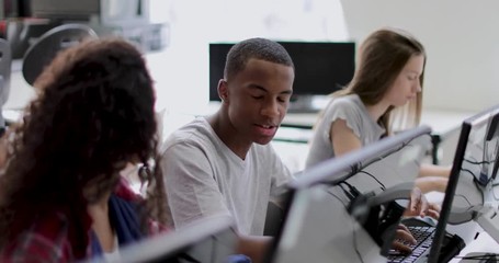 Students learning how to code in class