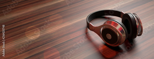Fotomural Headphones on wooden background, banner, copy space
