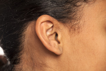 ear closeup of dark skinned female