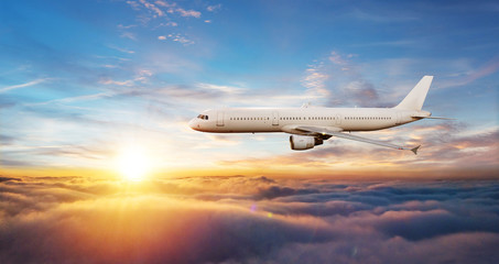 Detail of commercial airplane flying above clouds