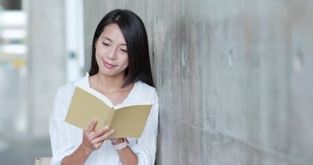 Sticker - Woman read on book in university campus