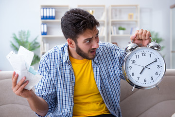 Wall Mural - Man frustrated at bills he needs to pay in time management conce