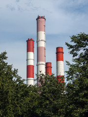 power plant pipes over the greenery