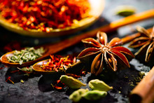 Spices. Various Indian Spices On Black Stone Table. Spice And Herbs On Slate Background. Cooking Ingredients