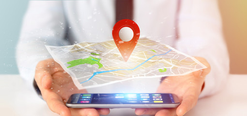 Poster - Businessman holding a 3d rendering pin holder on a map