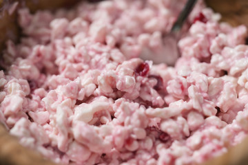 Wall Mural - closeup of cottage cheese with sour cream and cowberry jam in wood bowl on table