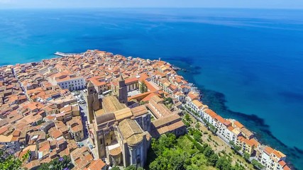 Wall Mural - Panoramic aerial view of Cefalu old town, Sicily, Italy. Cefalu is one of the major tourist attractions in the region. Picturesque view from Rocca di Cefalu. Time Lapse