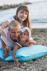 Wall Mural - Three children on the beach