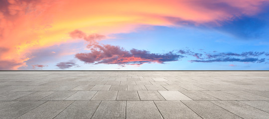 Clean square floor and beautiful colorful sky clouds at sunrise