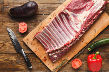 Wall Mural - Raw rack of lamb on wooden board