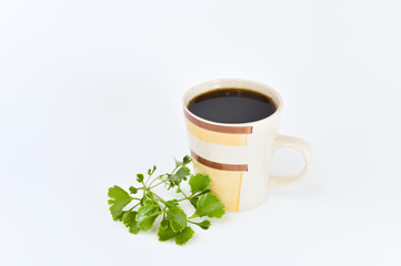 a cup of coffee with tropical flowers isolated on white background. selective focus.