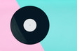 © Krisada - top view of a long play vinyl record or LP on the pink and blue background