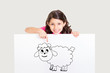 Cute girl showing white board with drawing of sheep - celebrating Eid ul Adha - Happy Feast