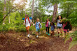 © Sergey Novikov - Group of kids on hiking walk holding hands