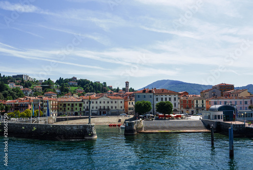 Fotografie, Obraz Luino, the beautiful town seen by tourists arriving by boat