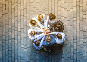 Fototapete - Stack of hands. Unity and teamwork concept.