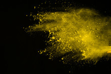Explosion Of Colored Powder Isolated On White Background. Power Or Clouds Splatted. Freez Motion Of Yellow Dust Exploding.