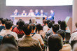 © THANANIT - Rear view of Audience in the conference hall or seminar meeting which have Speakers are Brainstorming and talking on the stage, business and education about investment concept