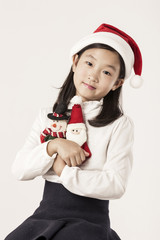 A asian girl hand hold a christmas gift on the white background.