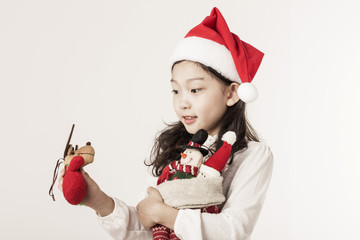 A asian girl hand hold a christmas gift on the white background.