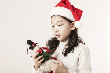 A asian girl hand hold a christmas gift on the white background.