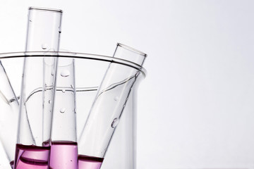 beaker and cylinder closeup isolated white.