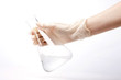 © dohee - hand hold a cylinder, beaker isolated white.