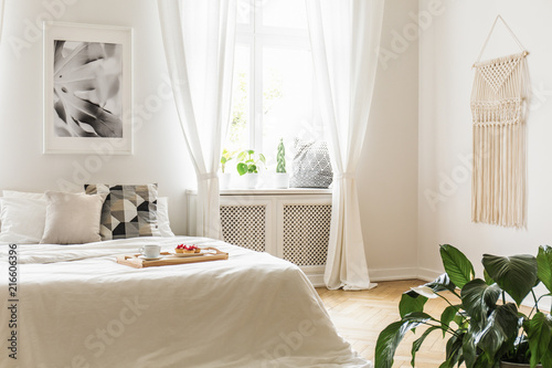 Breakfast Tray With Pastries And Coffee On A Cozy White Bed In A
