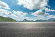 © ABCDstock - Empty asphalt road and mountains natural scenery under the blue sky