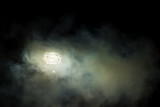 Fototapeta Sport - Light tower lit at a stadium during nightime.