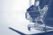 Shopping cart and credit card on laptop,online shopping and delivery service concept.