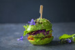 Avocado sandwich with green vegan burger,  roast yellow pepper and pickled red cabbage