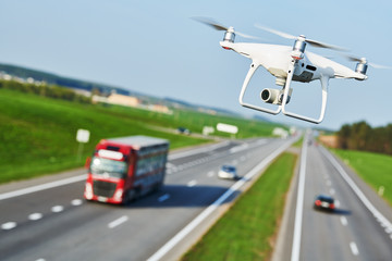 Wall Mural - drone and transportation. drone with camera controls highway road conditions
