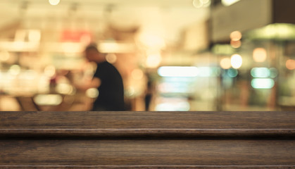 Sticker - Empty step dark wood table top ( food stand ) with blur customer dining at cafe restaurant background bokeh light,Mock up for display or montage of product,Banner for advertising online media.