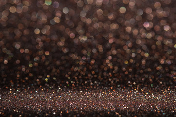 Poster - Abstract dark orange brown sparkling glitter wall and floor perspective background studio with blur bokeh.luxury holiday backdrop mock up for display of product.holiday festive greeting card