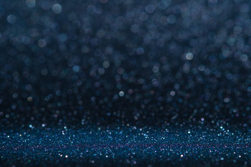 Poster - Abstract dark navy blue sparkling glitter wall and floor perspective background studio with blur bokeh.luxury holiday backdrop mock up for display of product.holiday festive greeting card.