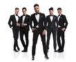 © Viorel Sima - five elegant grooms in tuxedoes with relaxed leader in front