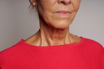 close-up of wrinkled skin mature woman's neck and face