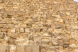 Kid sleeping on the wall of Egyptian pyramids in Giza, close up