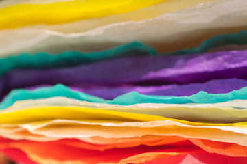 Wall Mural - stack of multicolored creased paper tissue macro