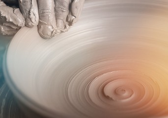 Hand of potter doing clay pot