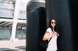 © nazariykarkhut - The young pretty girl is actively spending time on the street