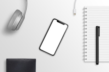 Aufkleber - Smart phone on office desk surrounded with headphones, pad, pencil, charger, wallet. Hero header scene. Isolated screen for mockup, app design presentation.