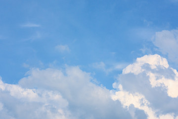 Wall Mural - fluffy cloud against blue sky background for summer and nature concept