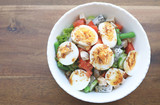 Fototapeta Maki - Diet menu. Healthy salad of fresh vegetables and egg on a bowl