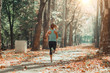 © Microgen - Woman Jogging Outdoors in The Fall