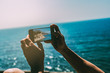 © ADDICTIVE STOCK - Man crop hands taking a photo of the landscape