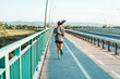 © Stock Rocket - Back view of athletic woman jogging on the street