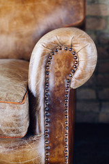 Wall Mural - Closeup texture of vintage brown leather sofa