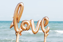 Balloon In The Shape Of The Word Love